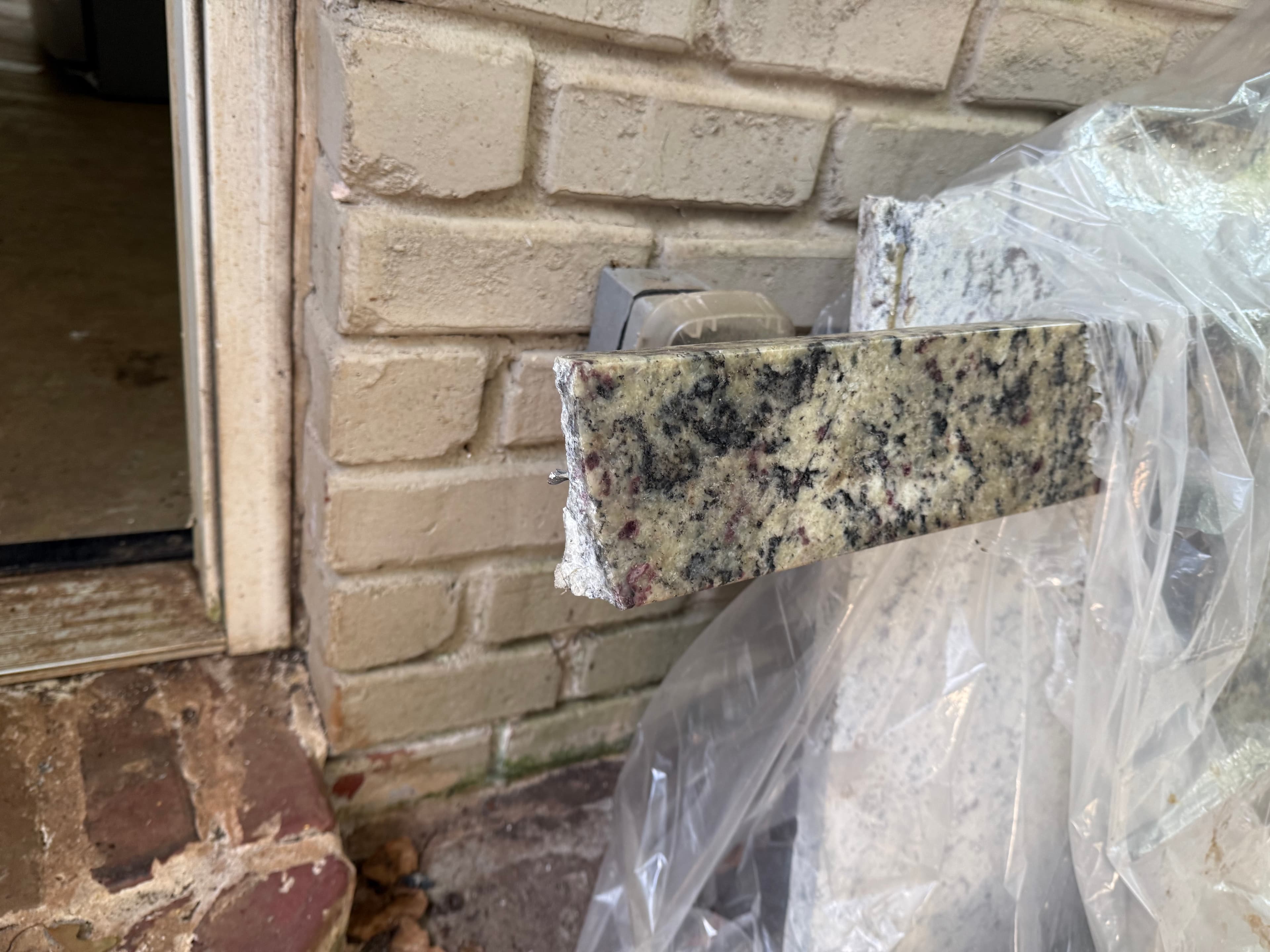 Granite countertop sections stored outdoors during reconstruction
