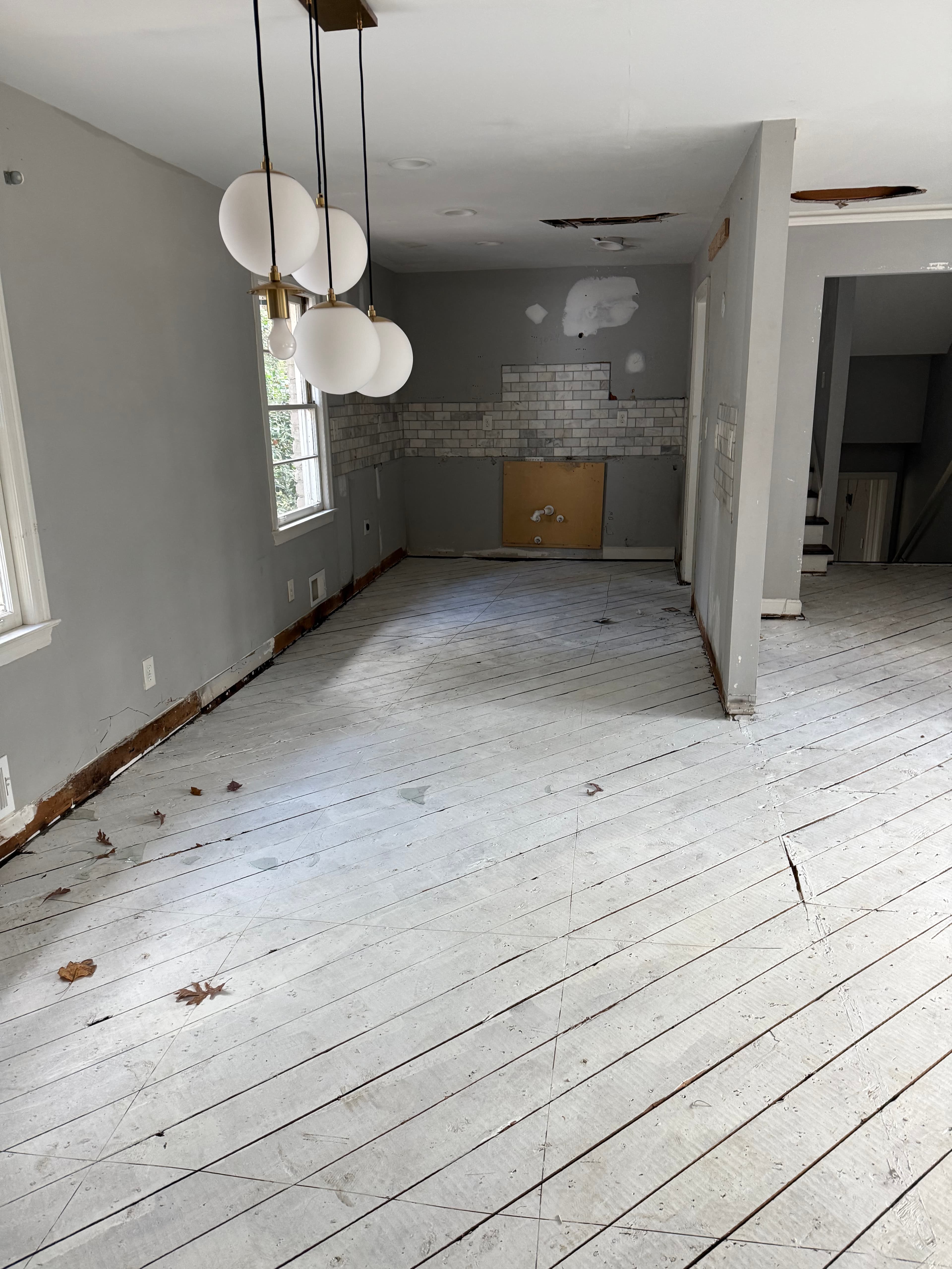 Interior hallway mid-reconstruction showing framing and drywall work