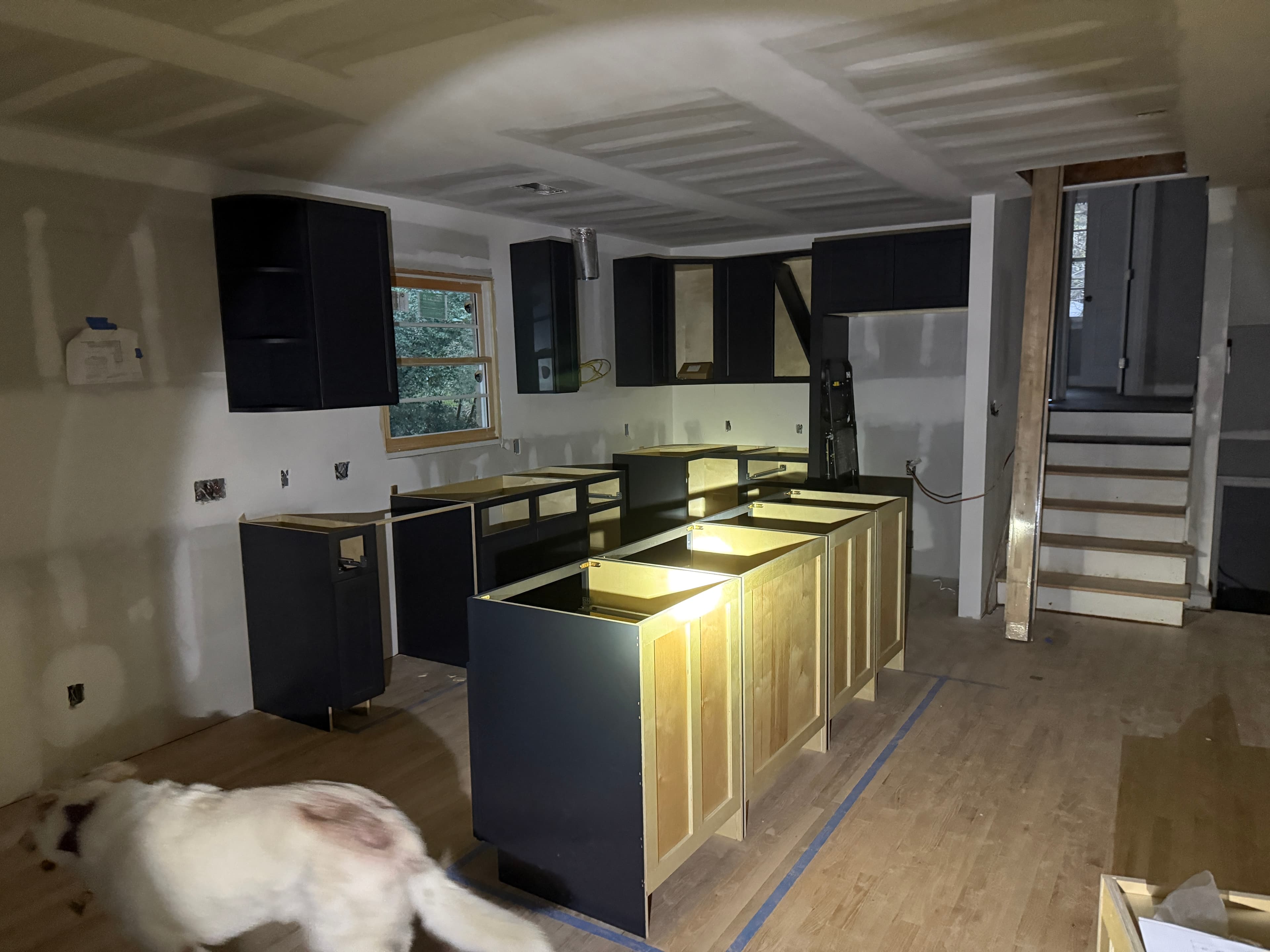 New kitchen cabinets being installed during reconstruction, October 2025